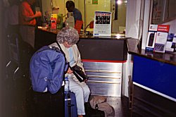 Mary Jo waiting for the bus at Gatwick